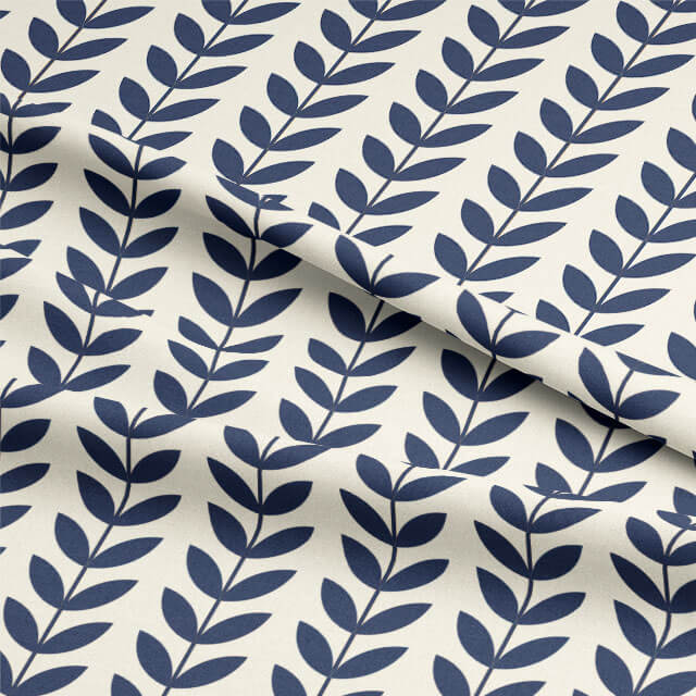 Close-up of Scandi Stem Navy linen blend fabric showing printed leaf design