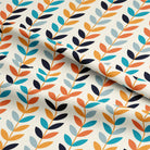 Repeating leaf pattern on Scandi Stem Orange linen fabric showing mustard, orange, navy, and aqua foliage