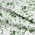 High-quality, textured green curtain fabric with a splash pattern, ideal for creating a modern and refreshing look