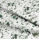This image showcases the luxurious texture and quality of the Splash Cotton Curtain Fabric in Spinach