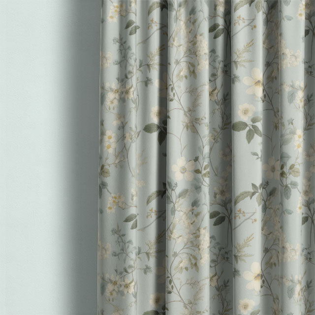 This image showcases the Spring Bloome Linen Curtain Fabric - Aqua, a soft and luxurious fabric that drapes beautifully and brings a calming, natural element to any space