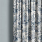 Troyes Toile Linen Curtain Fabric in Blue hanging gracefully in a sunlit room, adding a touch of elegance