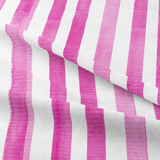 Close-up of Watercolour Stripe Cotton Curtain Fabric in Cerise, showcasing its texture