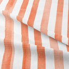Elegant watercolour stripe cotton curtain fabric in warm henna shade