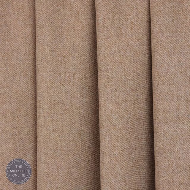 Soft and elegant, the Prestwick Pure Wool Curtain Fabric in Haze adds a touch of sophistication to any room