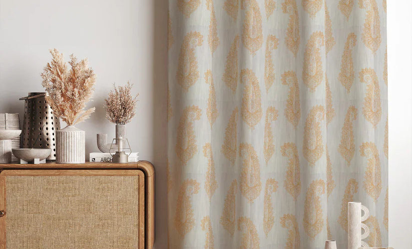 Ochre curtain fabric in warm mustard gold tones, neatly pleated and draped for curtain display