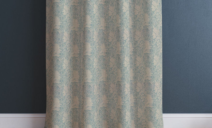 Close-up of patterned curtain hanging neatly with curtain hooks