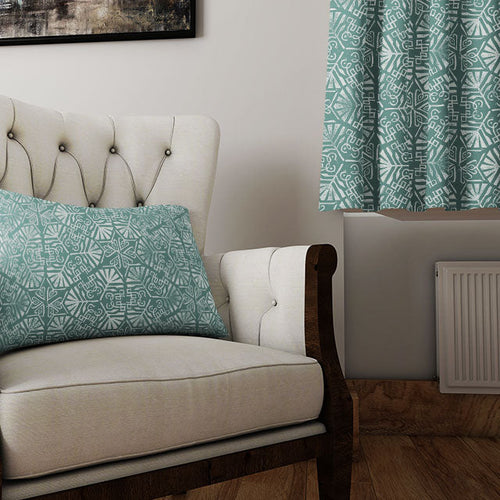 Geometric curtain fabric with bold angular print displayed in a streamlined, contemporary room