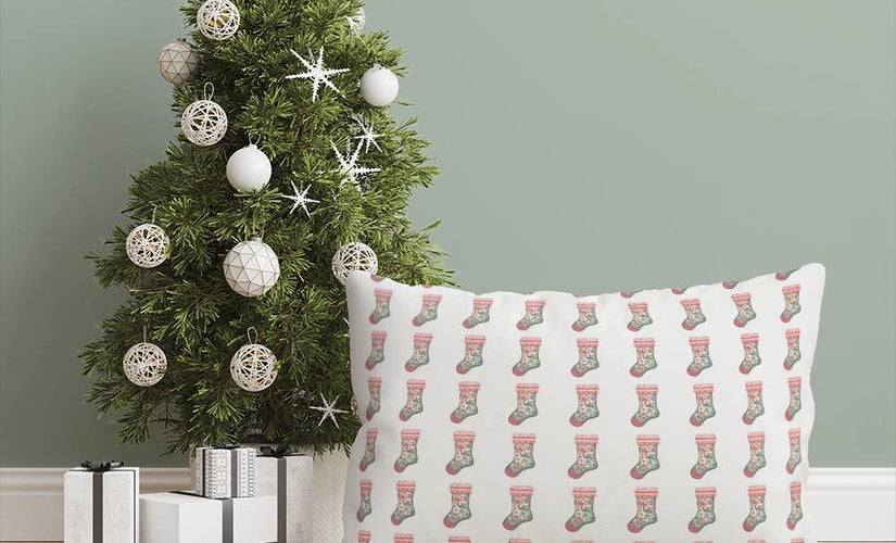 Christmas Roman blind fabric with festive stocking pattern, styled in a cosy seasonal living space.