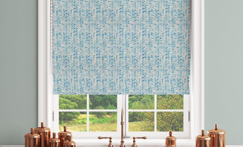 Roman blind panel of blue linen-blend fabric with subtle texture in a serene living room setting