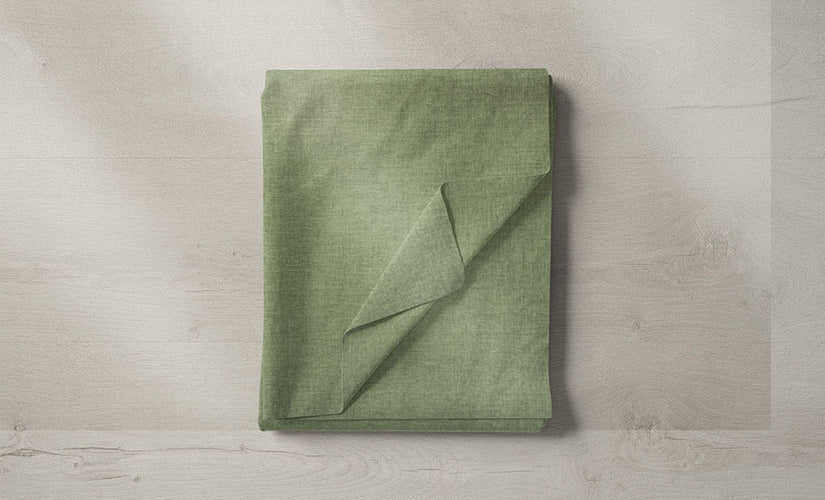 A collection of green fabrics in different patterns and textures, showcasing the versatility of green in home decor.