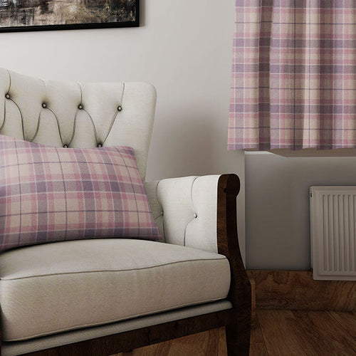 Elegant purple curtain fabric in rich bergundy and soft lilac tones, light filtering through texture