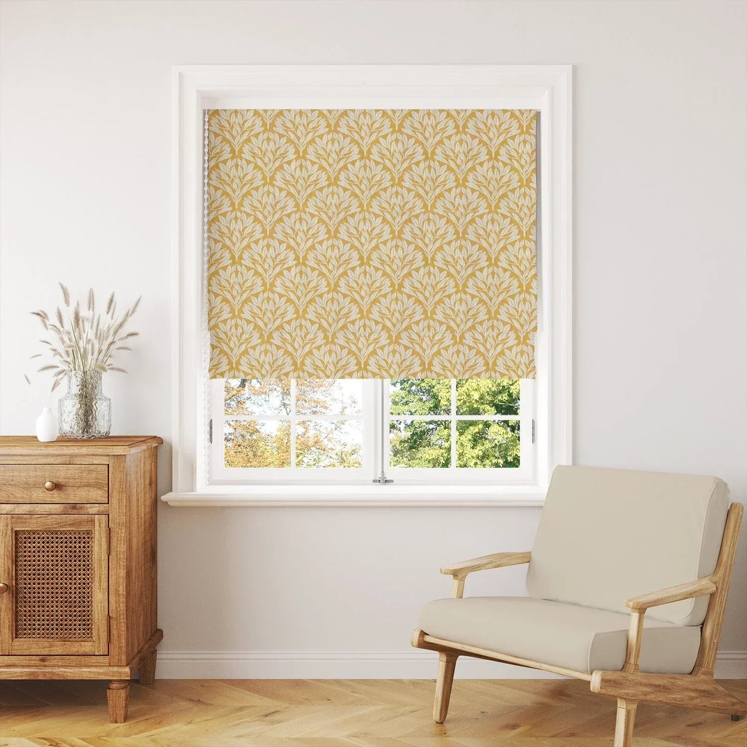Leaf fabric Roman blind in mustard yellow botanical pattern, styled in modern living room with wooden furniture