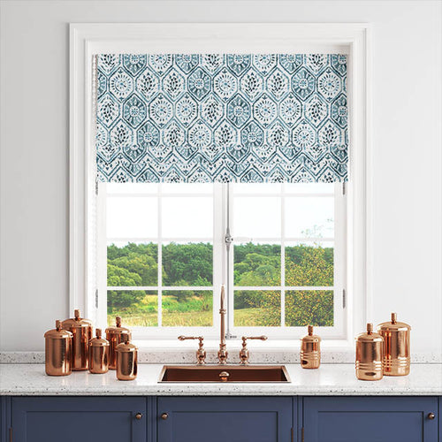 Kilim patterned made to measure Roman blind in blue and white fitted to a kitchen window