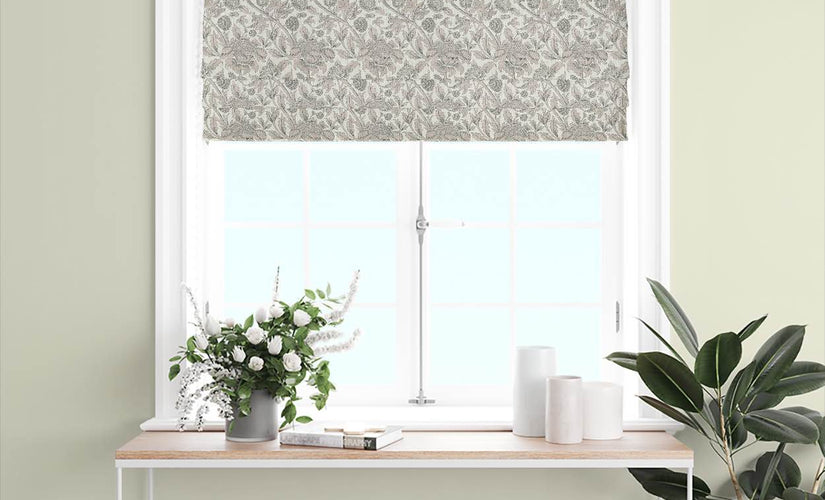 Ivory patterned Roman blind fabric fitted in a soft neutral kitchen window