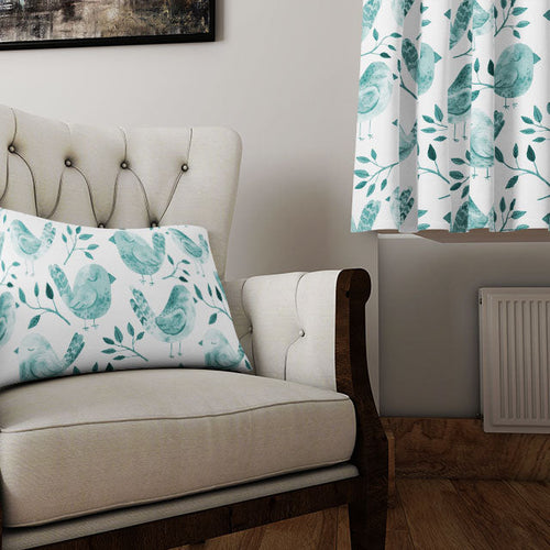 Aqua linen-blend curtain fabric panel in coastal blue draped above a whitewashed decor setting
