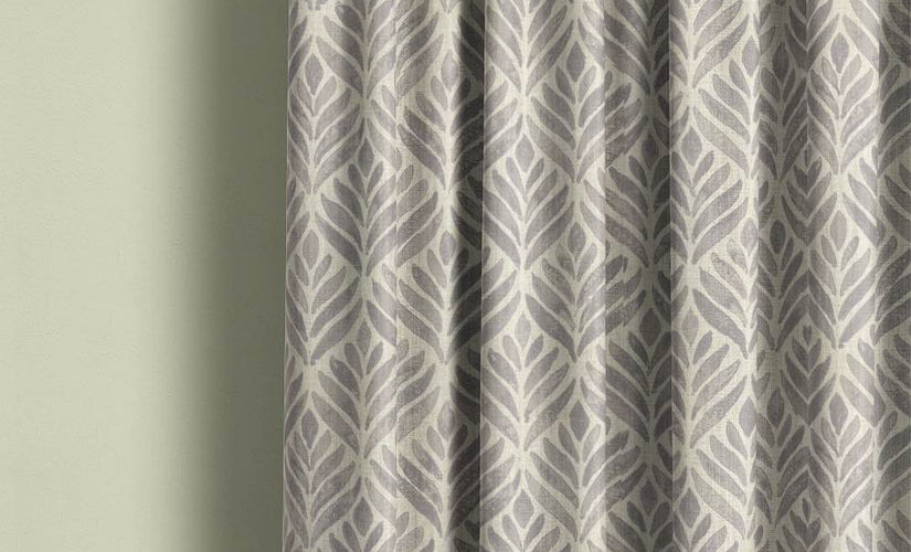 Dove grey made to measure curtains with leaf pattern design in a modern living room