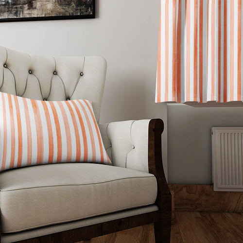 Rust and terracotta orange linen-blend curtain fabric swatch displayed in warm, textured folds