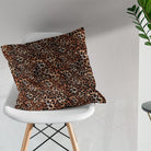 African leopard print fabric cushion showing warm animal print pattern