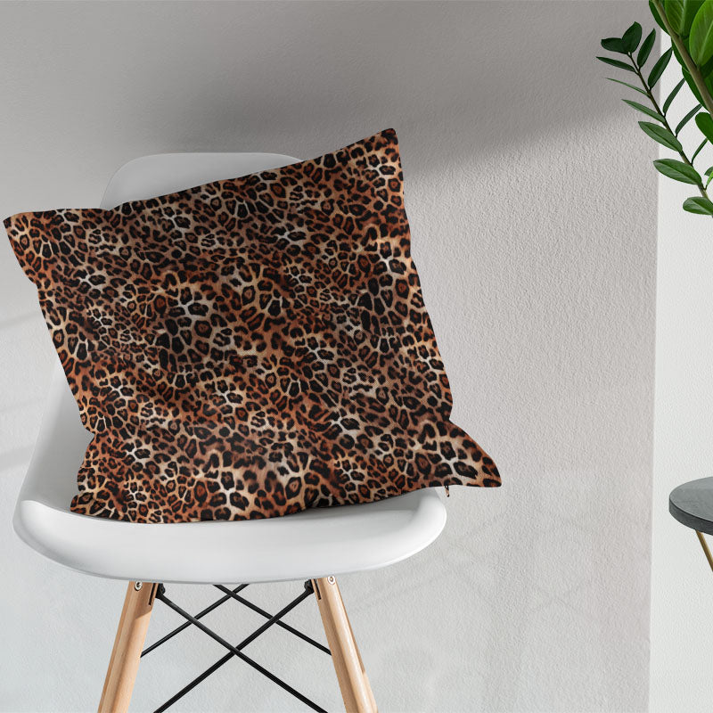 African leopard print fabric cushion showing warm animal print pattern