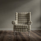 Traditional armchair upholstered in Alder Plaid Green check fabric
