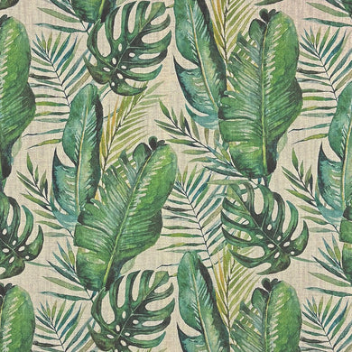 Close-up of Amazon Leaf green upholstery fabric with large painted jungle leaves on a natural background