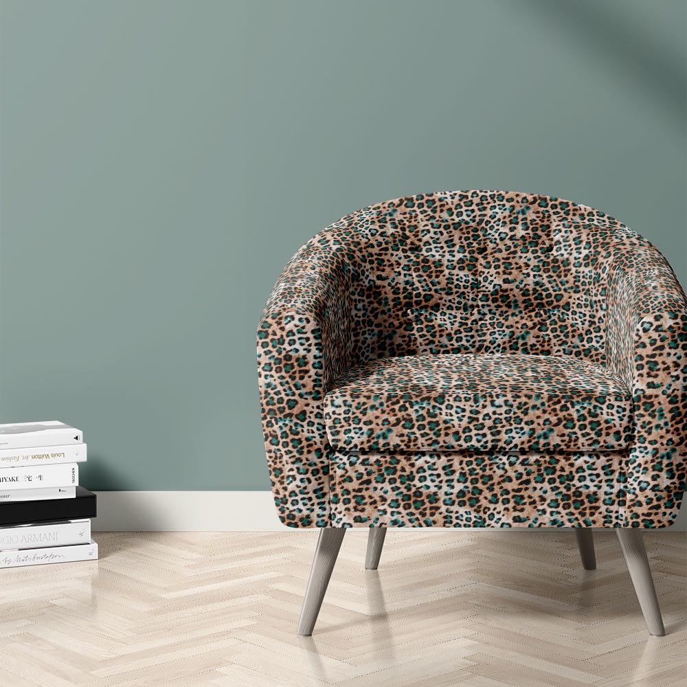 Amur leopard print fabric on chair for statement interiors