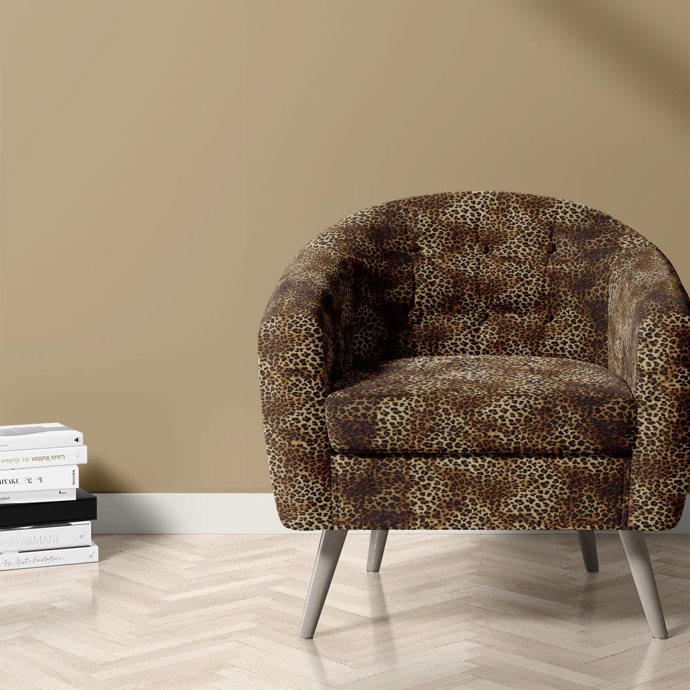 Arabian leopard print fabric on chair for bold room schemes