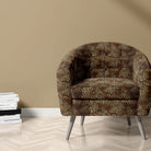 Arabian leopard print fabric on chair for bold room schemes