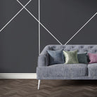 Mid-blue velvet sofa upholstered in Archway Blue upholstery fabric with striking white Art Deco arches