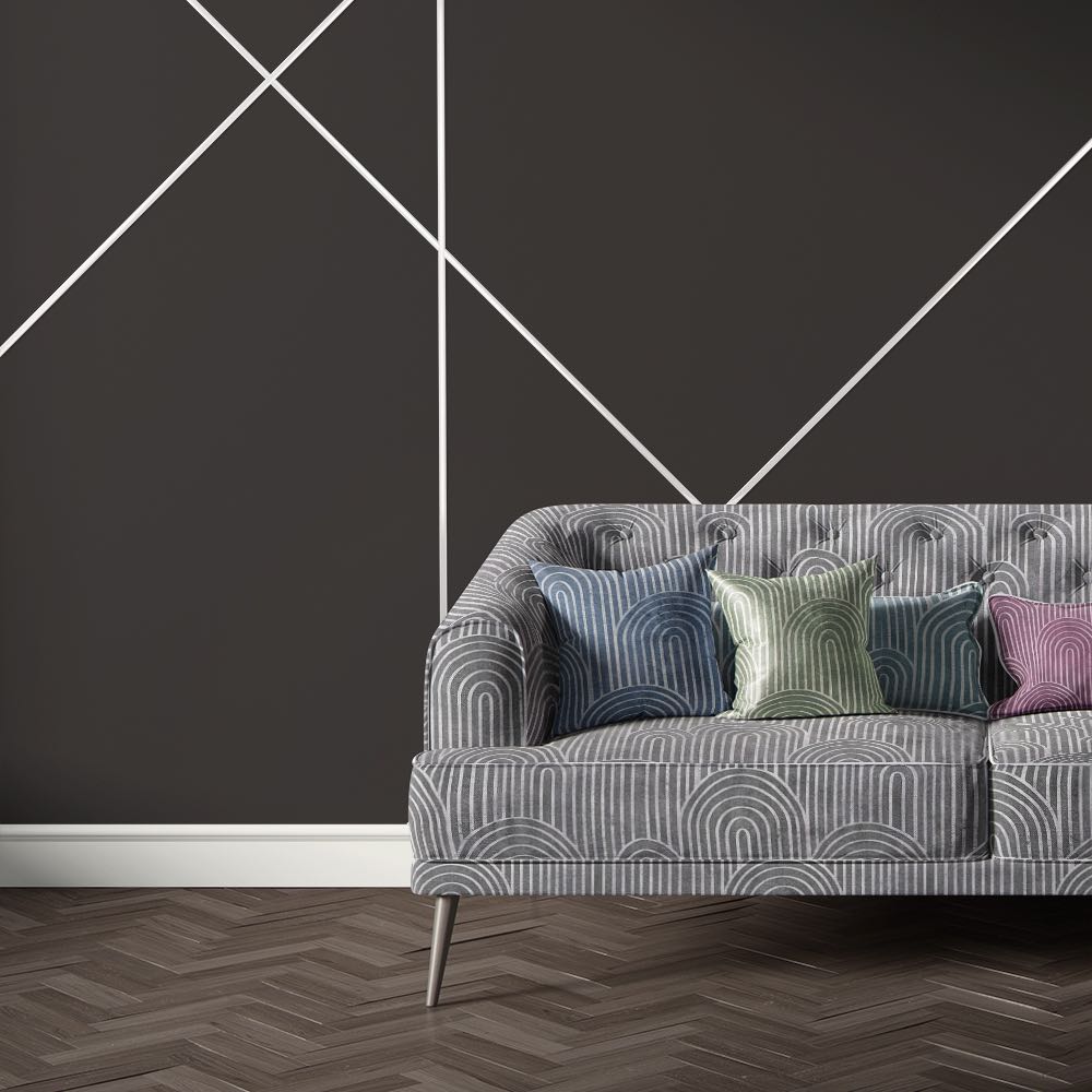 Grey velvet sofa upholstered in Archway Grey upholstery fabric featuring graphic arch shapes for a modern look