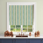 Green striped linen curtain fabric styled in a modern kitchen blind