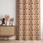 Autumn Leaf Golden polyester fabric shown as full-length curtains with warm orange and ochre foliage