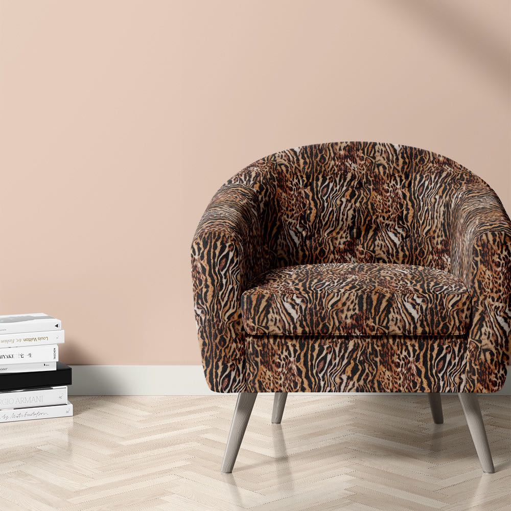 Bengal tiger print velvet fabric on upholstered chair for bold interiors