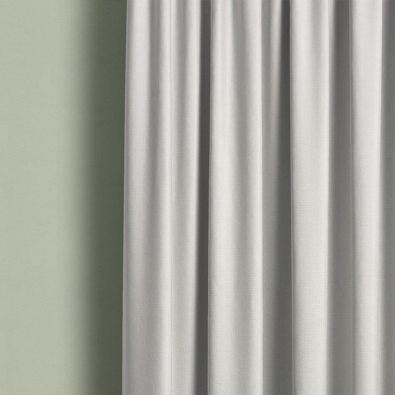 Boughton Plain White cotton linen curtain fabric hanging in soft folds