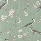 Bourton linen curtain fabric close up showing bird pattern on green linen basecloth