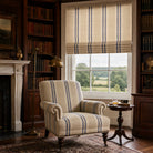 Braemar Stripe Upholstery Fabric in Navy roomset with striped fabric chair