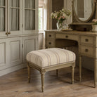 Braemar Plum striped upholstery fabric shown on stool, purple stripe fabric for chairs, cushions and traditional room schemes