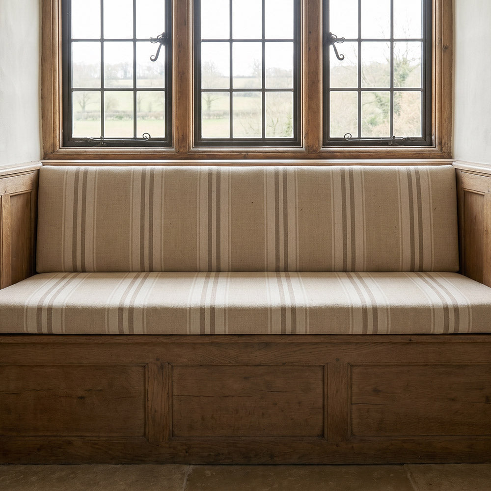 Braemar Stripe Upholstery Fabric in Putty on upholstered bench