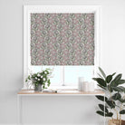 Calstock Ivory floral linen curtain fabric used for a Roman blind featuring soft botanical flowers on a white background in a bright window setting