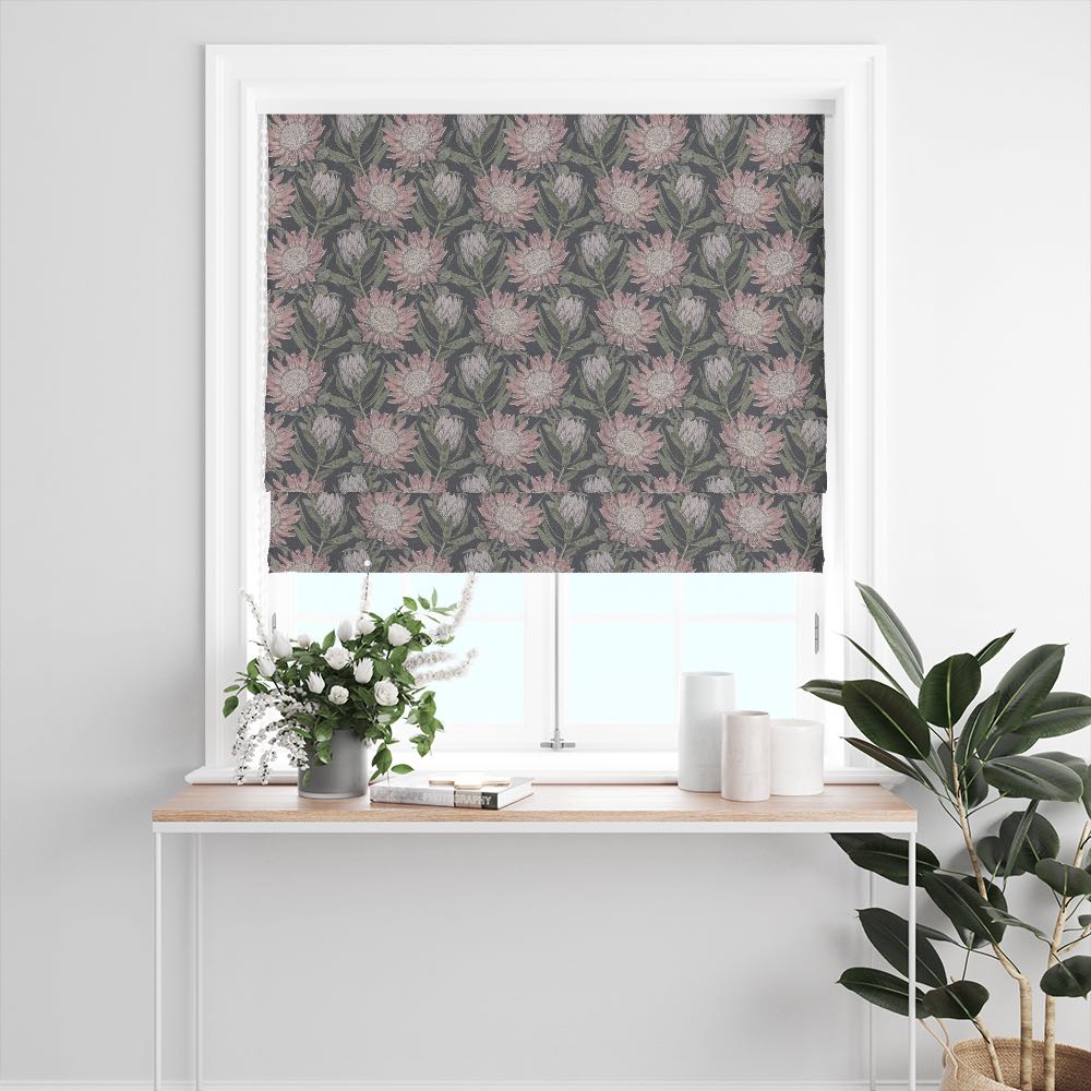 Calstock Navy floral linen curtain fabric styled as a Roman blind with detailed botanical florals in soft grey on a dark navy backdrop