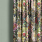 Canterbury Flower Green velvet curtain fabric draped with stained glass style flowers in multicolour on rich green base