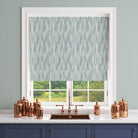 Roman blind in Dallas Blue striped curtain fabric, styled in a window with soft mid-blue brushstroke stripes.