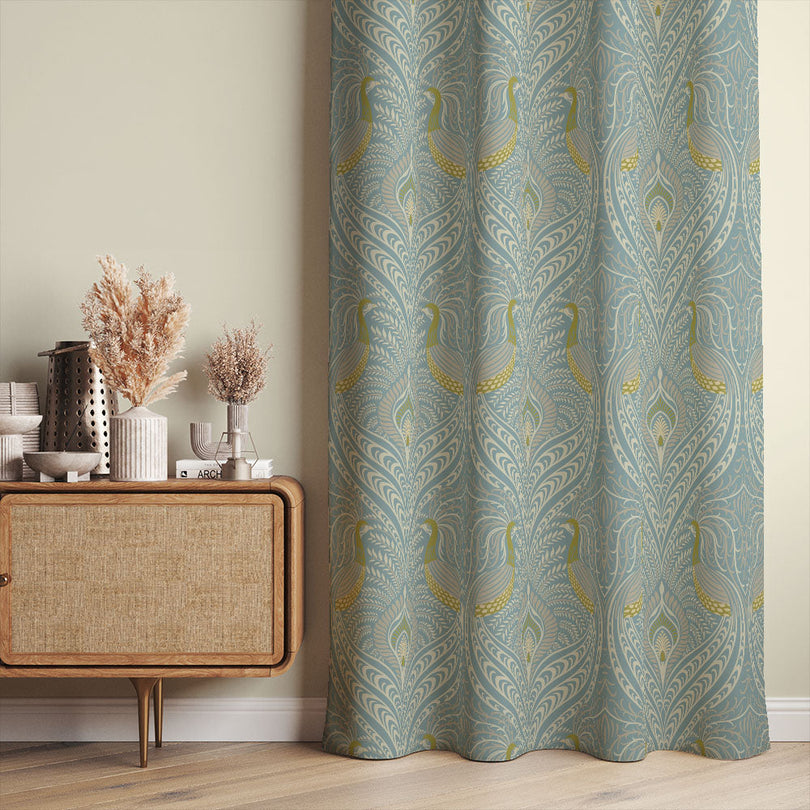 A stylish room with the Deco Peacock Linen Curtain Fabric adding a touch of sophistication