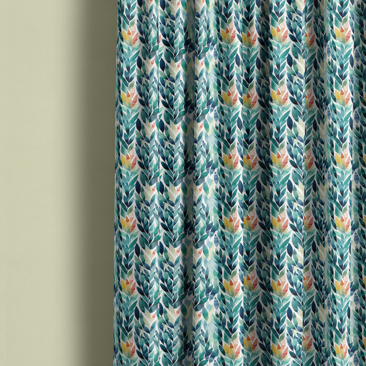 Delamere washable leaf fabric made into patterned curtains with teal, navy and green foliage