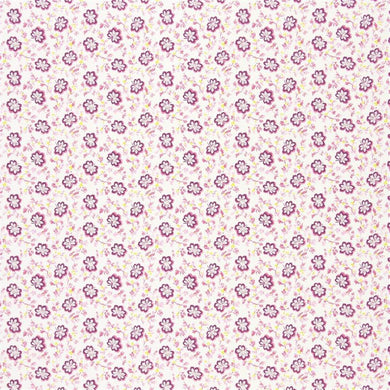 Designers Guild Camomile curtain fabric in Fuchsia with a pink floral pattern.