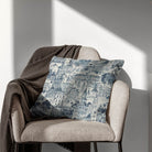 Edinburgh indigo cityscape curtain fabric styled as a cushion for a classic interior