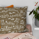 Brown horse print fabric cushion styled for a warm traditional country living space