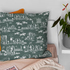 Green horse print washable fabric shown on a cushion for a relaxed country interior