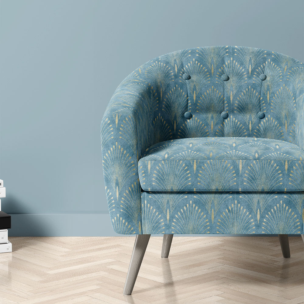 Feathercrest Azure fire retardant velvet fabric shown upholstered on a chair with blue fan design